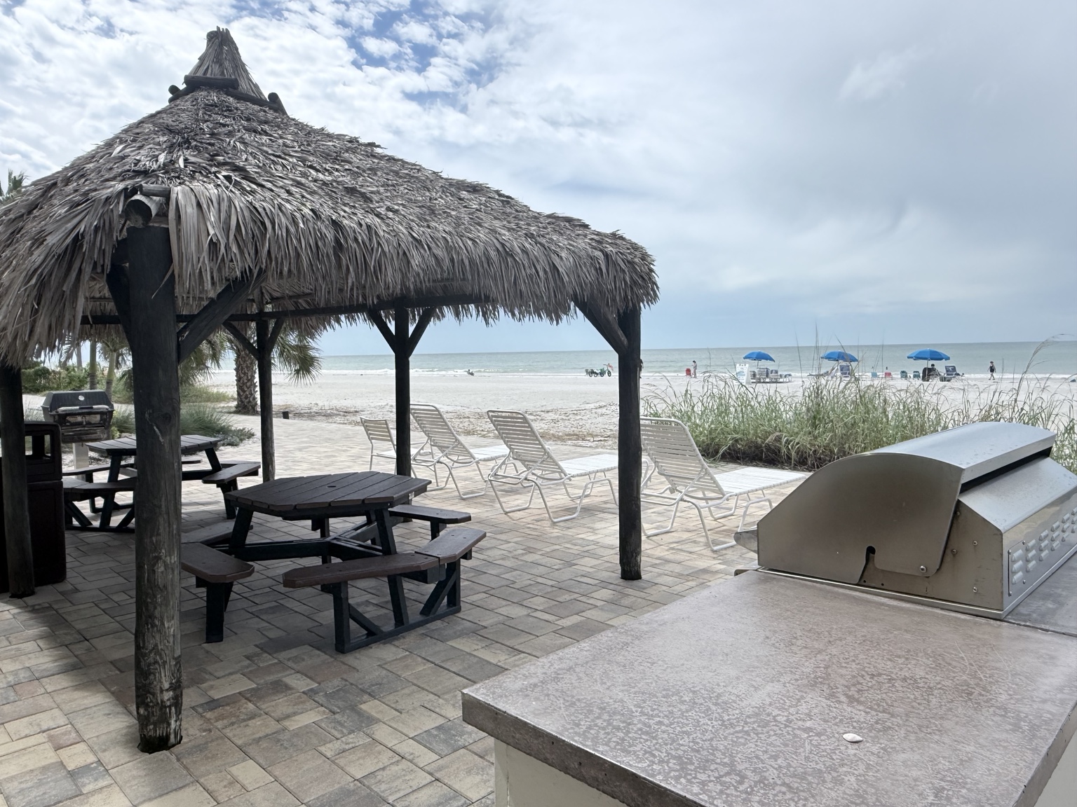 Tiki hut picnic area and grills overlooking Indian Shores beach